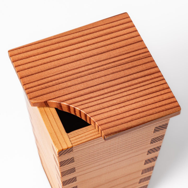 Japanese cedar sake carafe with square lid and visible joinery, combining natural wood texture with traditional craftsmanship for authentic sake service.