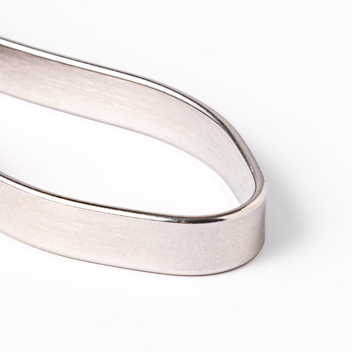 Japanese daikon julienne peeler with stainless steel blade and ergonomic looped handle for thin vegetable strips