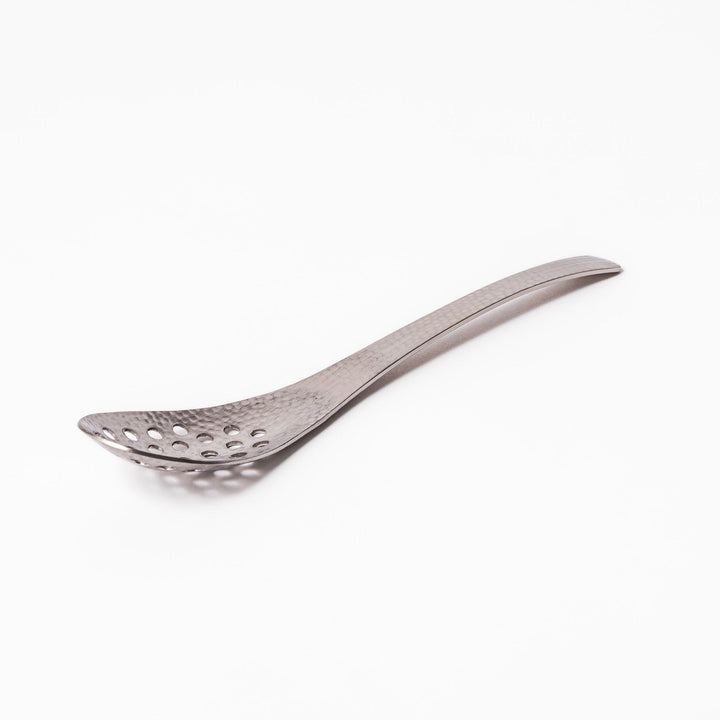 Handcrafted Japanese hammered straining spoon with perforated bowl, ideal for skimming or serving foods while draining excess liquid.