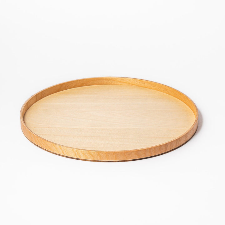 Minimalist Japanese round wooden tray with raised edge, crafted from natural wood, perfect for serving tea, snacks, or organizing small items.