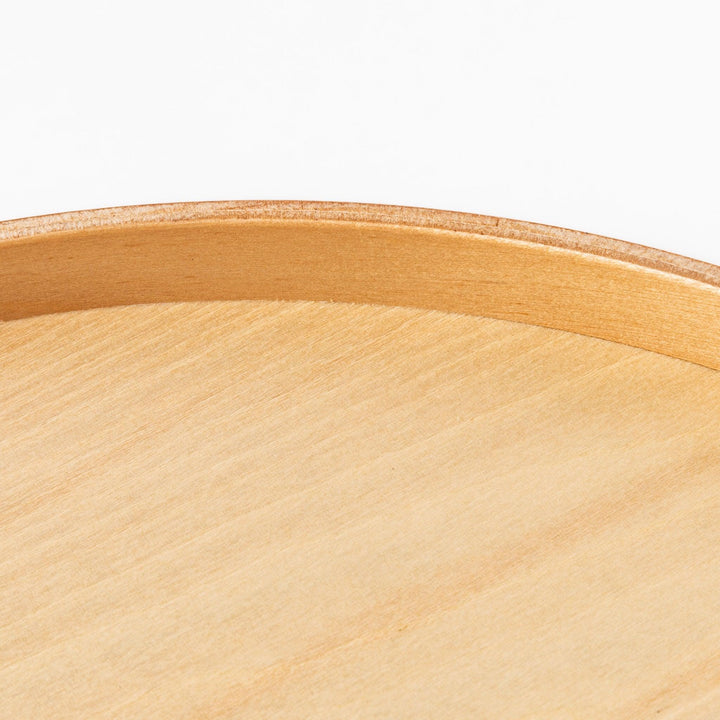Minimalist Japanese round wooden tray with raised edge, crafted from natural wood, perfect for serving tea, snacks, or organizing small items.