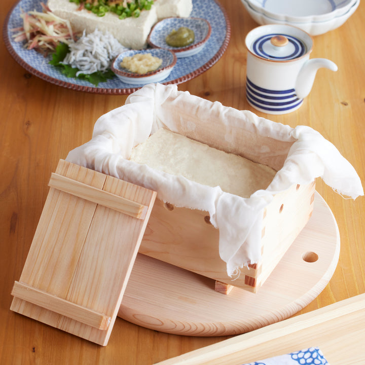 Handcrafted Hinoki wood tofu maker box lined with cloth, designed in Japan for pressing and forming fresh homemade tofu with natural aroma and smooth texture.