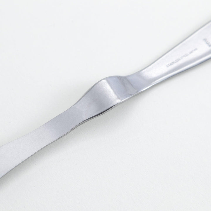 Stainless steel jam spreader with a sleek, double-ended design.