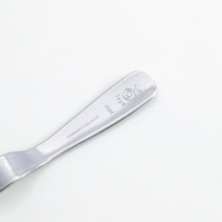 Stainless steel jam spreader with a sleek, double-ended design.