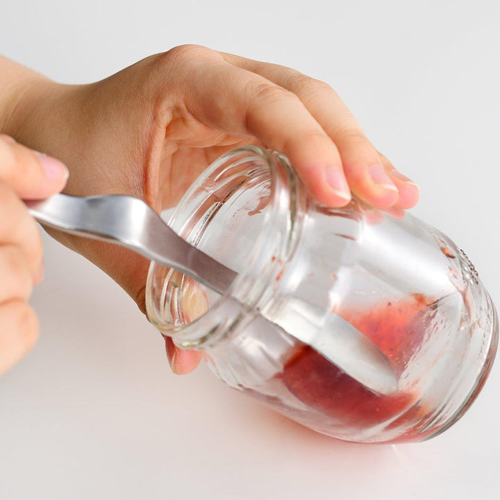 Stainless steel jam spreader with a sleek, double-ended design.