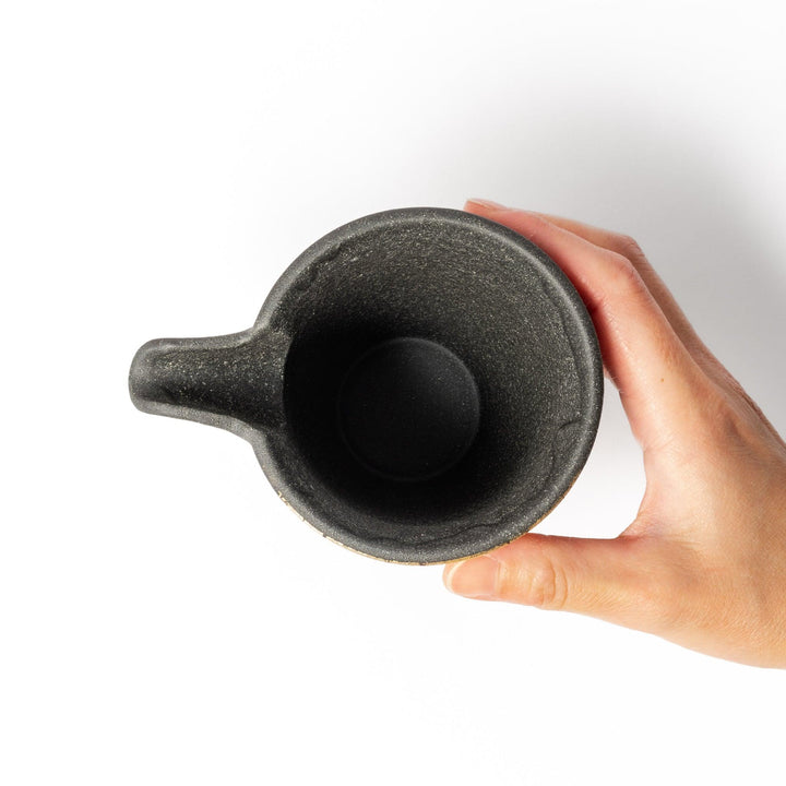 Kintsugi-inspired black Kutani sake carafe with striking gold crackle pattern, showcasing traditional Japanese aesthetics and modern ceramic design.