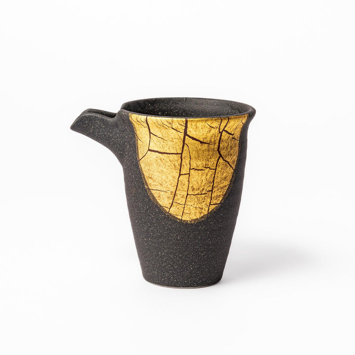 Kintsugi-inspired black Kutani sake carafe with striking gold crackle pattern, showcasing traditional Japanese aesthetics and modern ceramic design.