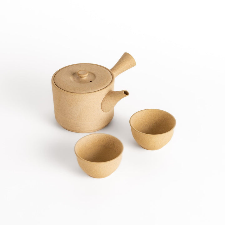 Elegant large beige tea set featuring a round teapot with spout and matching bowls, perfect for enjoying your favorite tea in style.