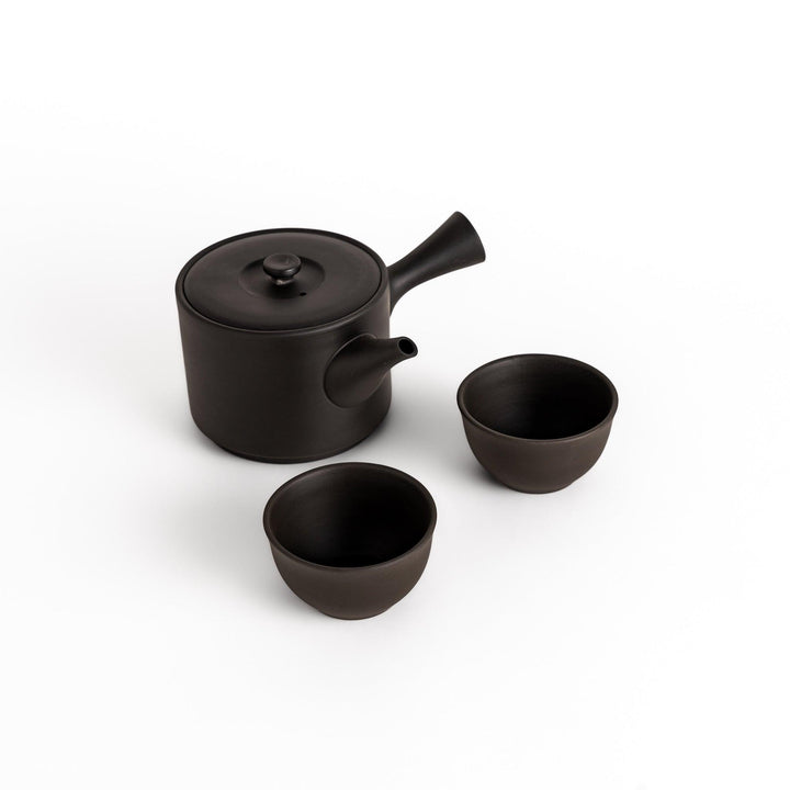 Elegant large black tea set featuring a round teapot with spout and matching bowls, perfect for enjoying your favorite tea with style.