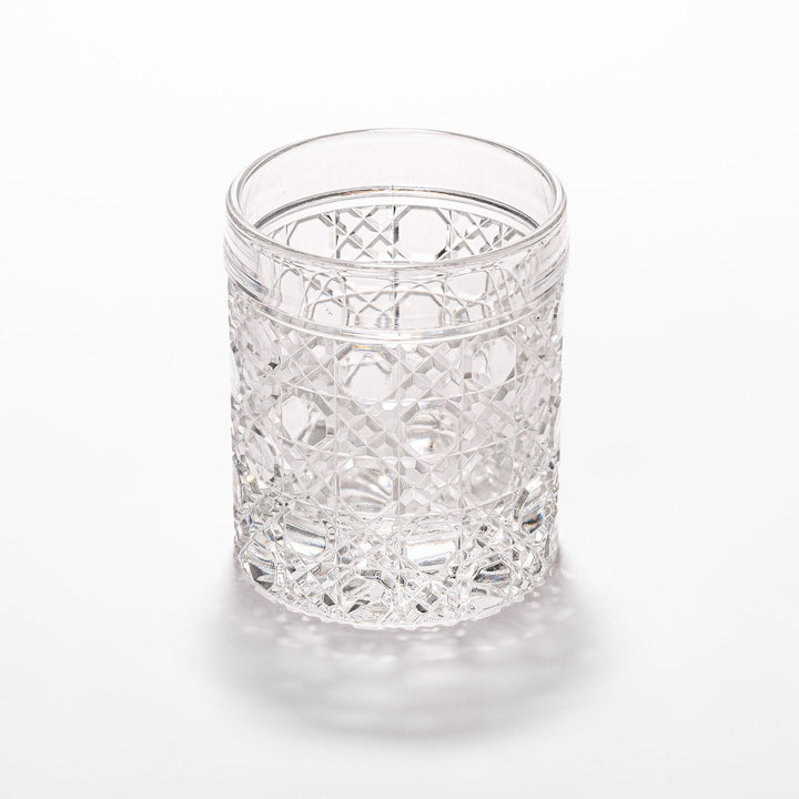 Classic rocks glass with an intricate lattice cut design, perfect for serving whiskey or other spirits with a sophisticated touch.