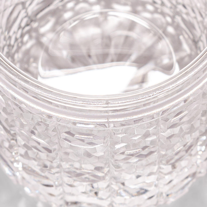 Classic rocks glass with an intricate lattice cut design, perfect for serving whiskey or other spirits with a sophisticated touch.