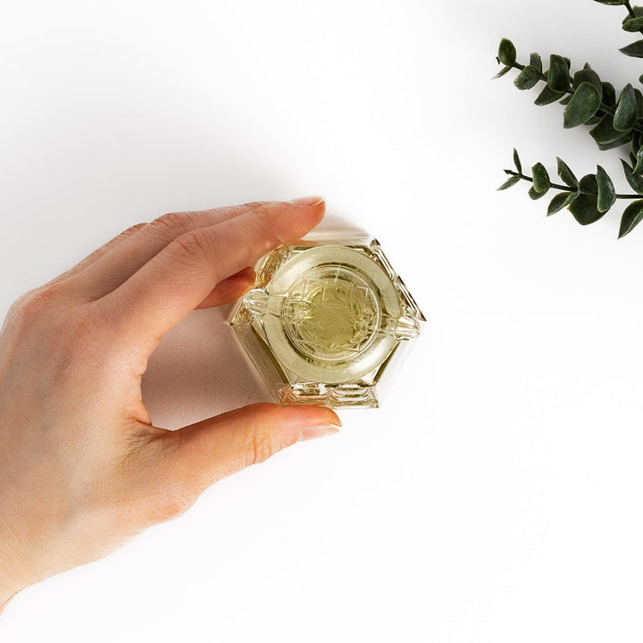 Stylish soy sauce dispenser with a geometric lattice cut design, featuring a smooth pour spout and elegant hexagonal base.