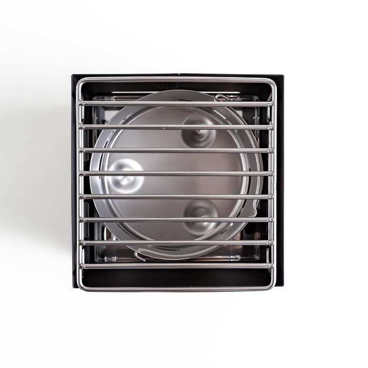 A top view of a luxe tabletop grill, showcasing its sleek design and functional stove features.