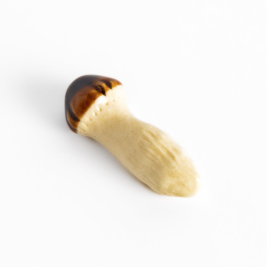 Matsutake Mushroom Chopstick Rest, a charming ceramic rest shaped like a realistic matsutake mushroom, perfect for holding chopsticks while adding a natural touch to the table.