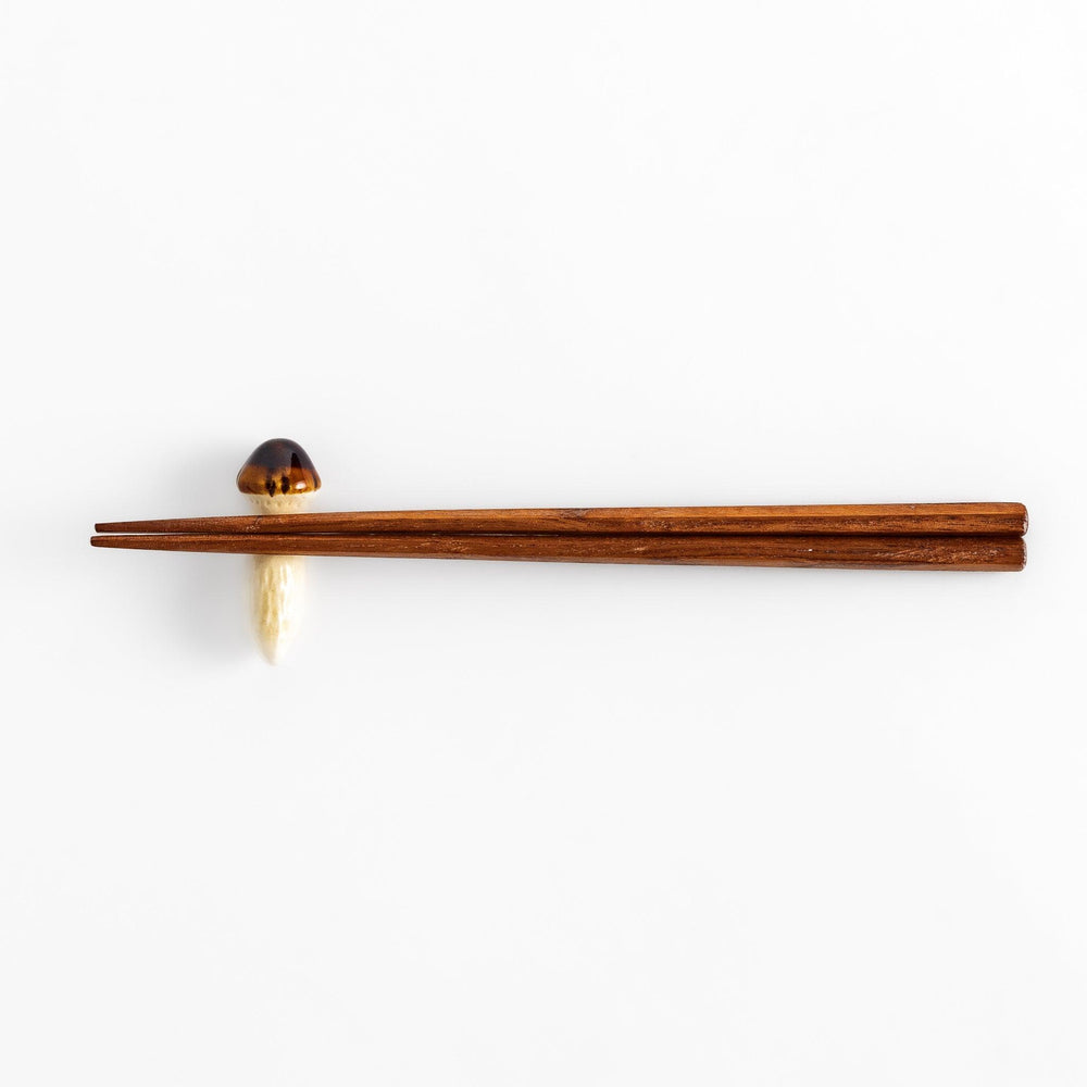 Matsutake Mushroom Chopstick Rest, a realistic ceramic rest shaped like a matsutake mushroom, perfect for holding chopsticks with a natural, earthy touch.