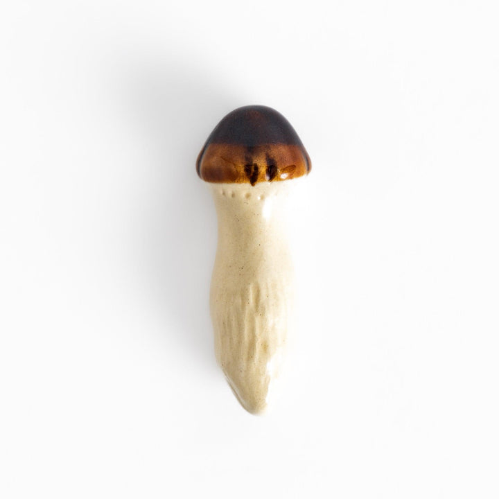 Matsutake Mushroom Chopstick Rest, a charming ceramic rest shaped like a realistic matsutake mushroom, perfect for holding chopsticks while adding a natural touch to the table.