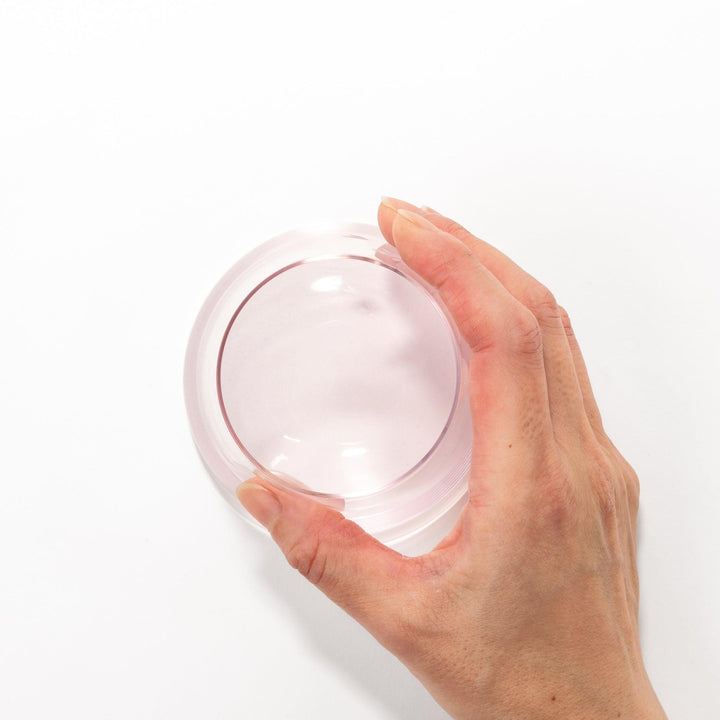 Light pink Mount Fuji–shaped beer glass with delicate etched cherry blossom pattern, ideal for springtime drinks and elegant table settings.