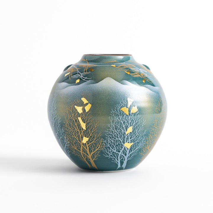 Handcrafted vase featuring a tranquil mountain scene with golden leaf accents and delicate trees, capturing a serene, nature-inspired design in soft teal tones.