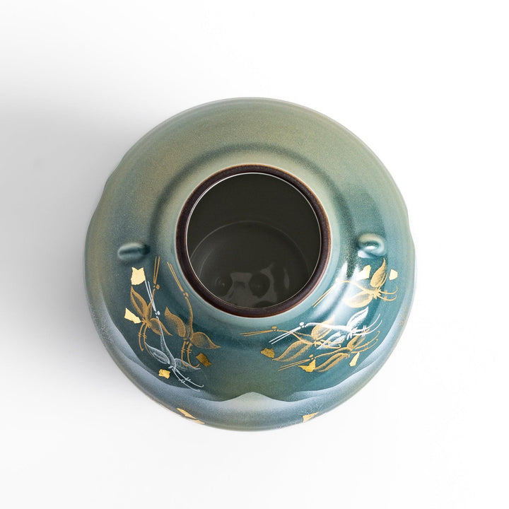 Handcrafted vase featuring a tranquil mountain scene with golden leaf accents and delicate trees, capturing a serene, nature-inspired design in soft teal tones.