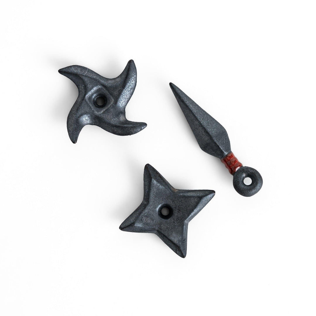 Set of ninja star and shuriken-shaped chopstick rests with a metallic finish, adding a fun and edgy touch to your dining experience.