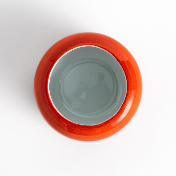 Persimmon Lidded Condiment Bowl, a ceramic bowl with a glossy orange finish and a detailed lid shaped like a persimmon leaf, perfect for serving sauces and condiments.
