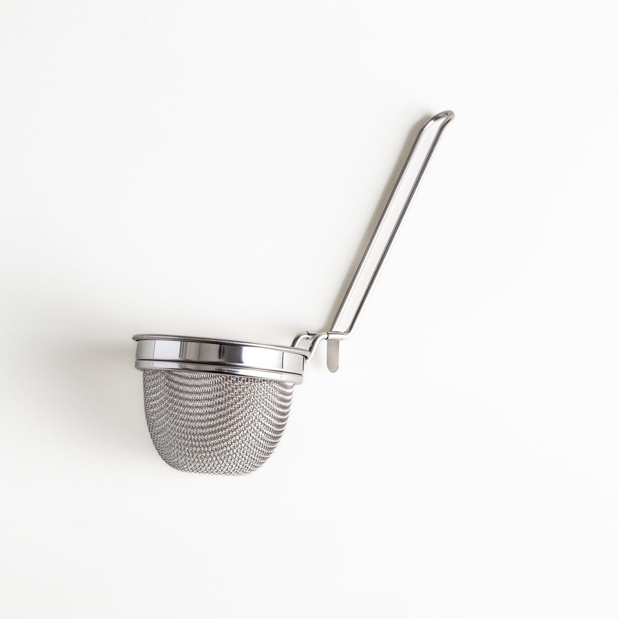 Stainless steel miso strainer with a fine mesh and a long handle, a handy kitchenware tool for straining miso paste and making smooth miso soup.