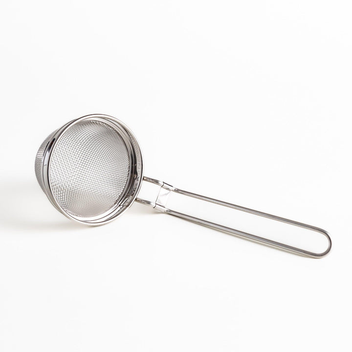 Stainless steel miso strainer with a fine mesh and a long handle, a handy kitchenware tool for straining miso paste and making smooth miso soup.