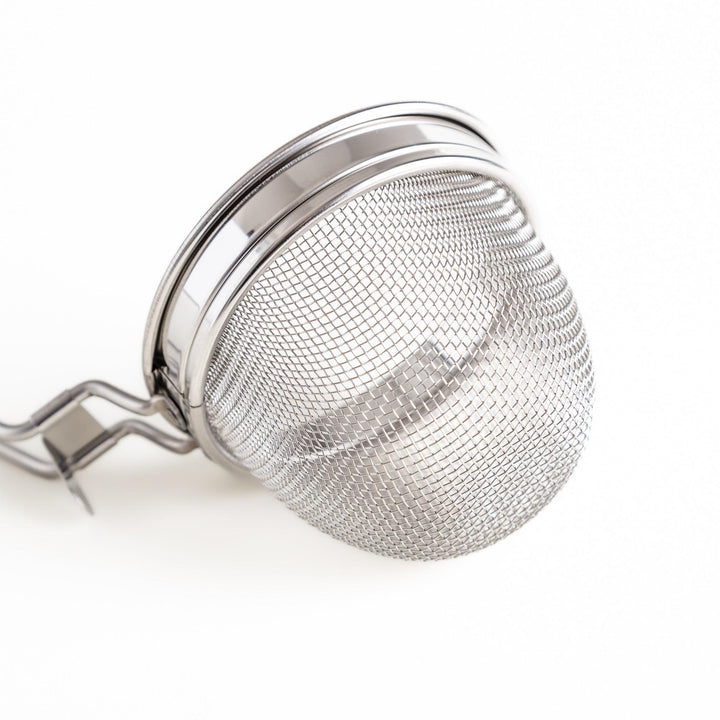 Stainless steel miso strainer with a fine mesh and a long handle, a handy kitchenware tool for straining miso paste and making smooth miso soup.