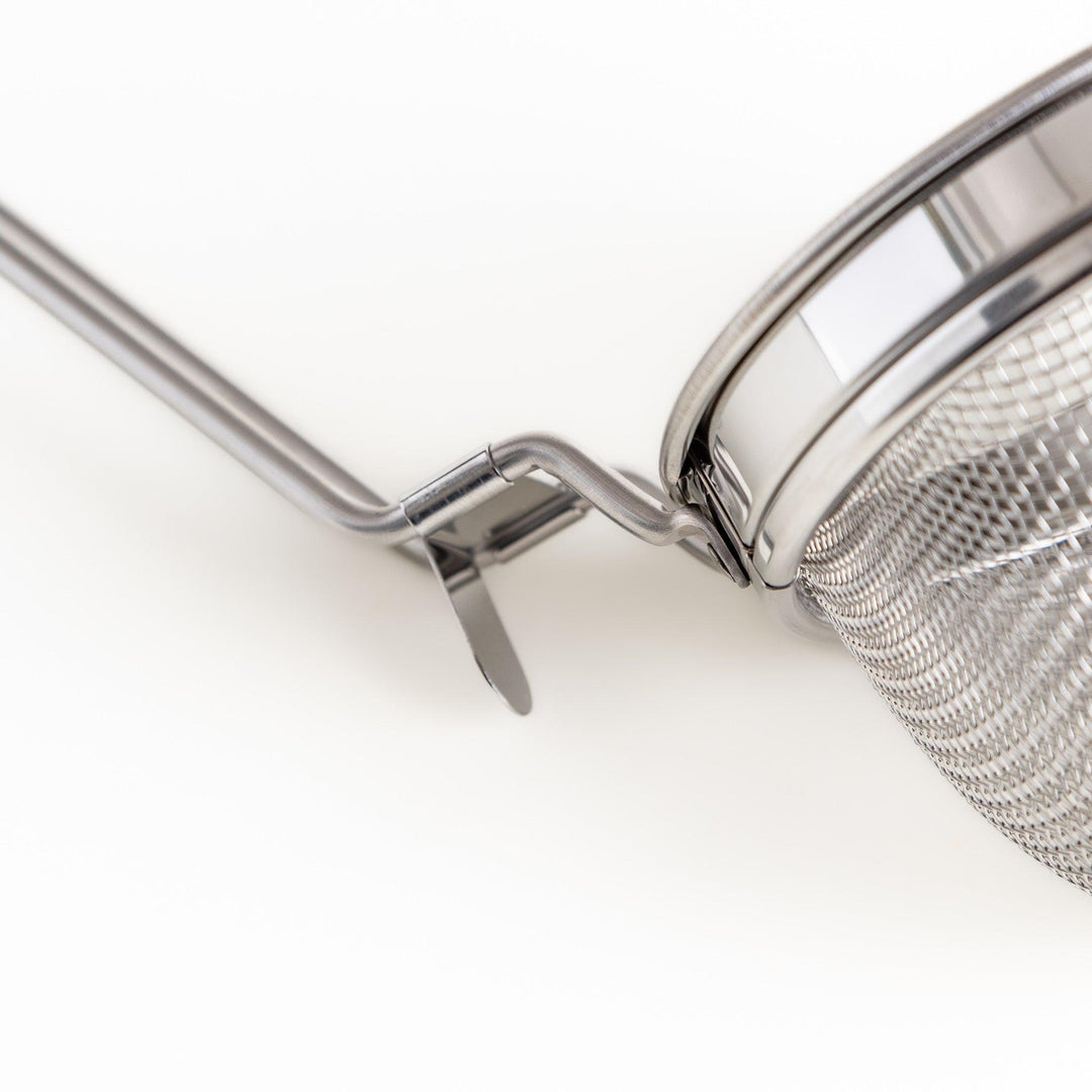 Stainless steel miso strainer with a fine mesh and a long handle, a handy kitchenware tool for straining miso paste and making smooth miso soup.