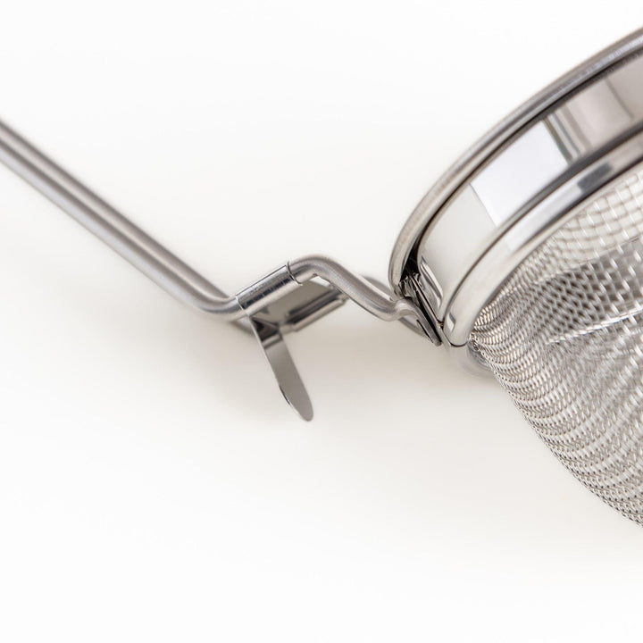 Stainless steel miso strainer with a fine mesh and a long handle, a handy kitchenware tool for straining miso paste and making smooth miso soup.