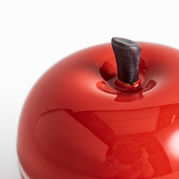 Red Apple Lidded Condiment Bowl, a charming apple-shaped ceramic bowl with a glossy red finish and a small black stem, perfect for serving sauces and condiments.