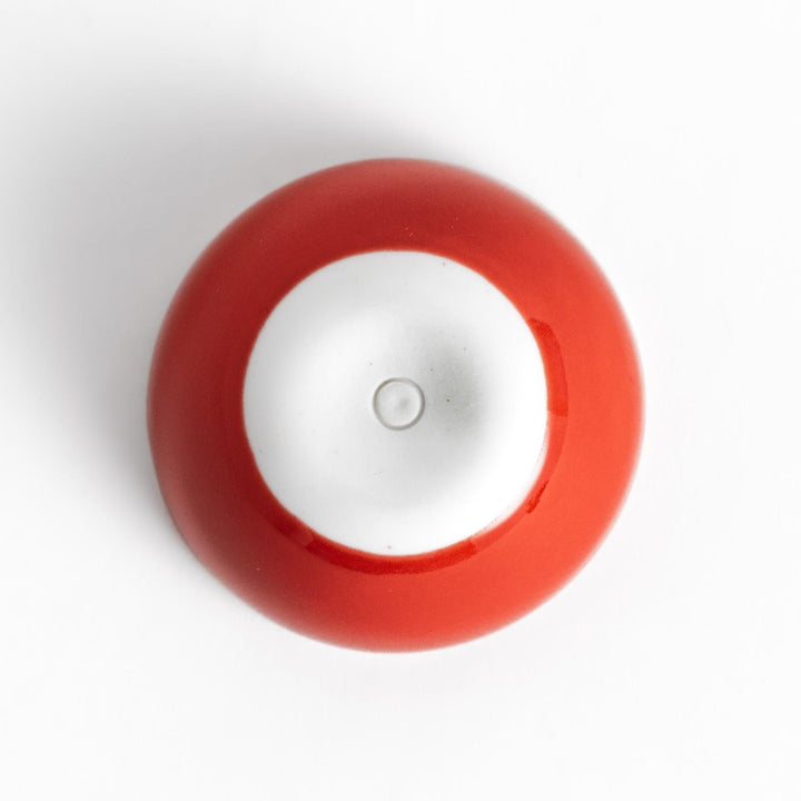 Red Apple Lidded Condiment Bowl, a charming apple-shaped ceramic bowl with a glossy red finish and a small black stem, perfect for serving sauces and condiments.