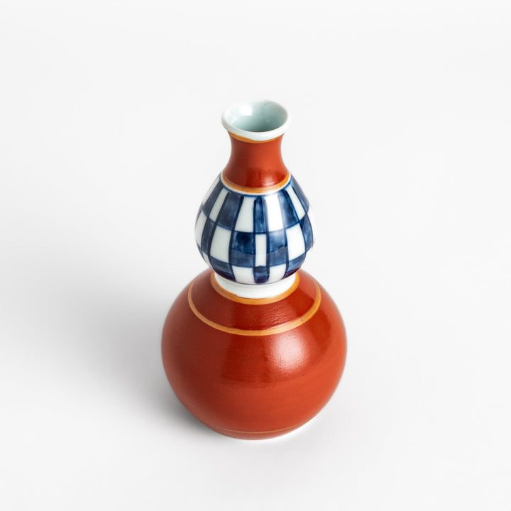 Elegant Japanese Sake Carafe featuring a red and white design with gold accents, perfect for serving your favorite sake.