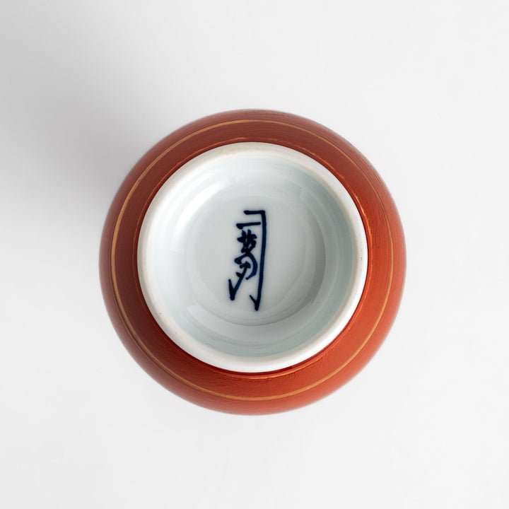 Elegant Japanese Sake Carafe featuring a red and white design with gold accents, perfect for serving your favorite sake.