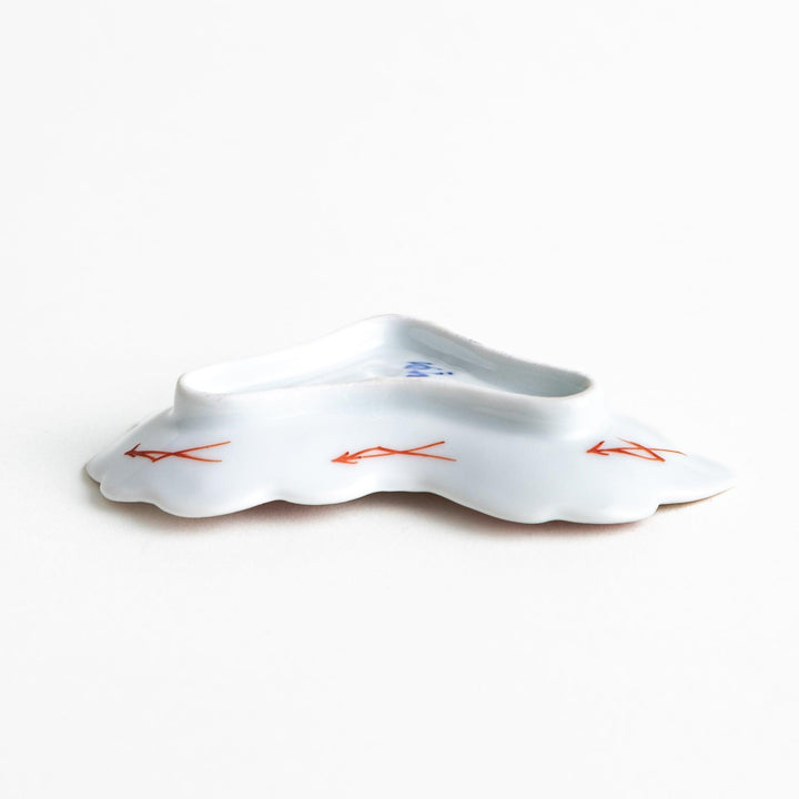 Orange chrysanthemum-shaped plate with gold outlining