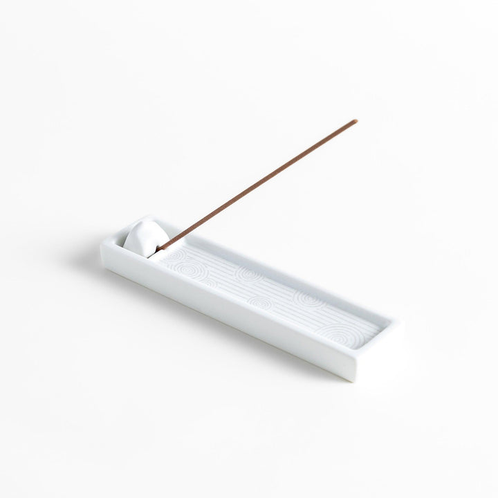 Zen-inspired white ceramic Incense Holder featuring a raked sand pattern.