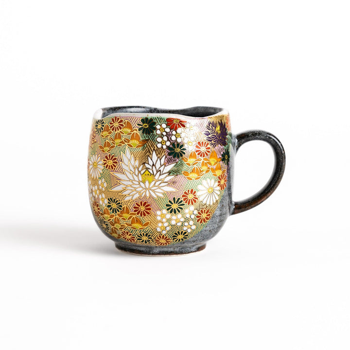 Gray ceramic mug with a vibrant floral pattern in gold and pastel colors, featuring a comfortable handle and a unique speckled glaze.