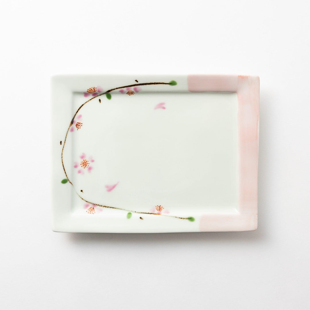 Rectangular dessert plate with a delicate cherry blossom design, featuring soft pink and green accents along the edges.