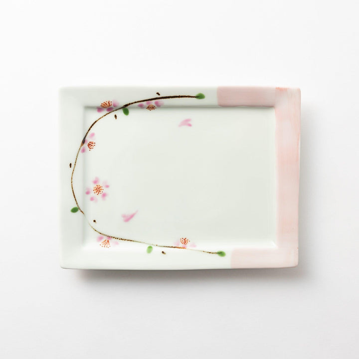 Rectangular dessert plate with a delicate cherry blossom design, featuring soft pink and green accents along the edges.