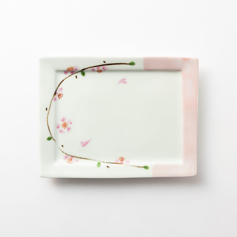 Rectangular dessert plate with a delicate cherry blossom design, featuring soft pink and green accents along the edges.