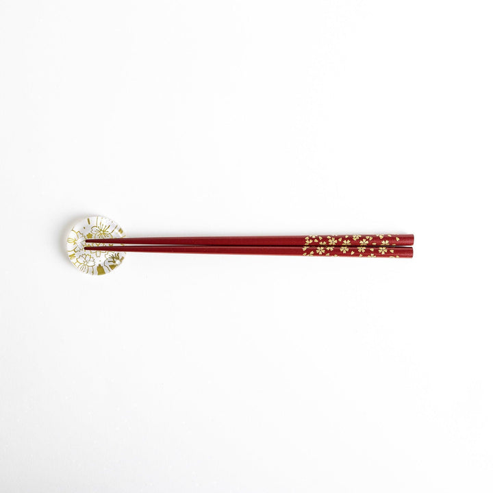 Red lacquer chopsticks with sakura patterns. Available in black or red.