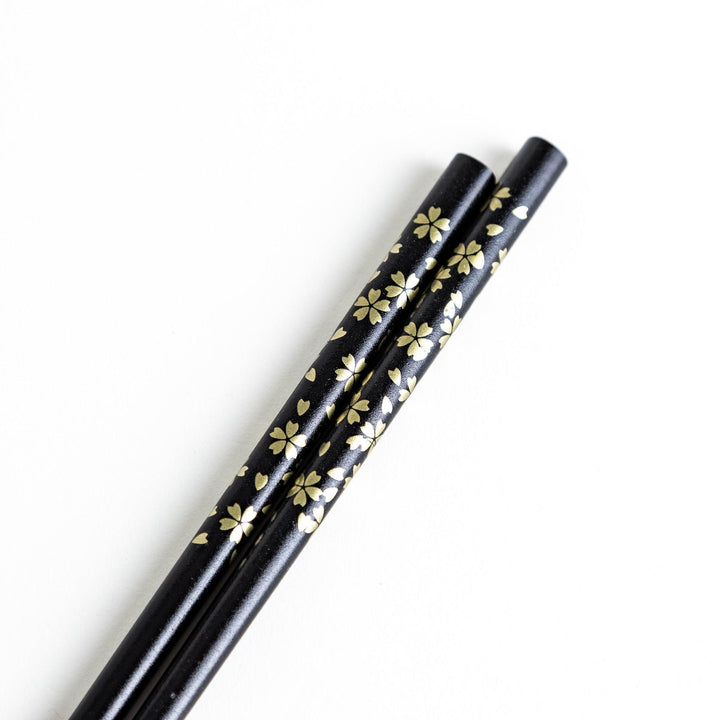 Red lacquer chopsticks with sakura patterns. Available in black or red.