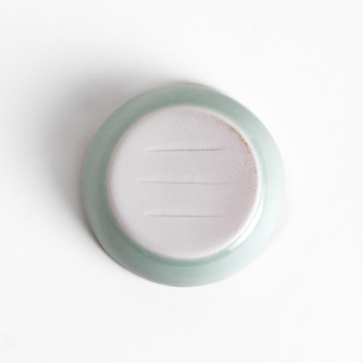 Samurai Helmet Lidded Condiment Bowl, a ceramic bowl with a unique lid shaped like a samurai helmet, featuring intricate blue and gold detailing, perfect for serving sauces.