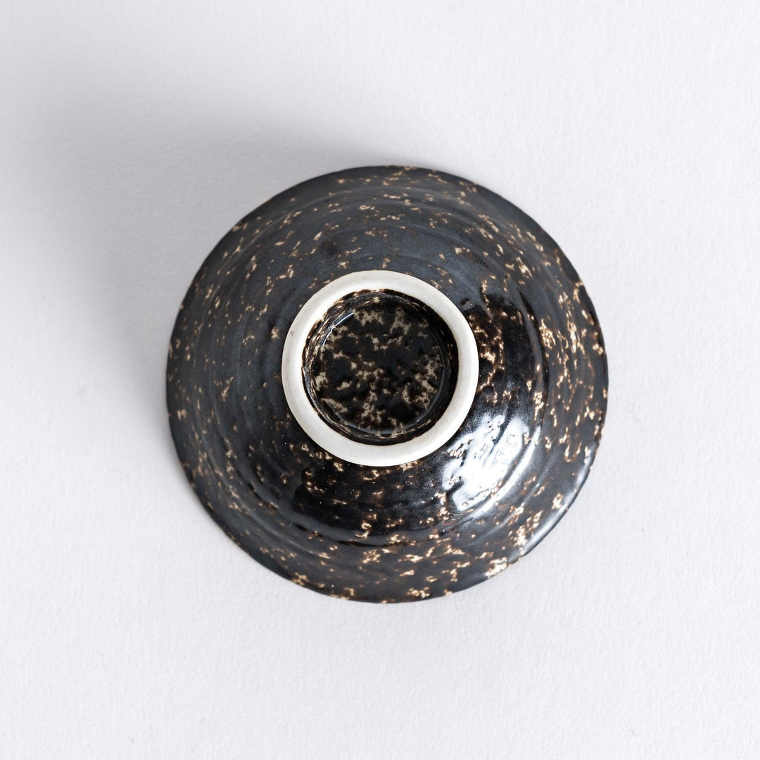 Bottom view of the silver rustic finish sake cup, revealing its smooth base with subtle texture around the edge.