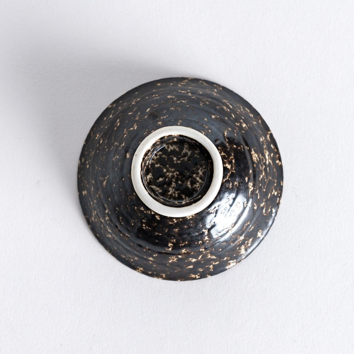 Bottom view of the silver rustic finish sake cup, revealing its smooth base with subtle texture around the edge.