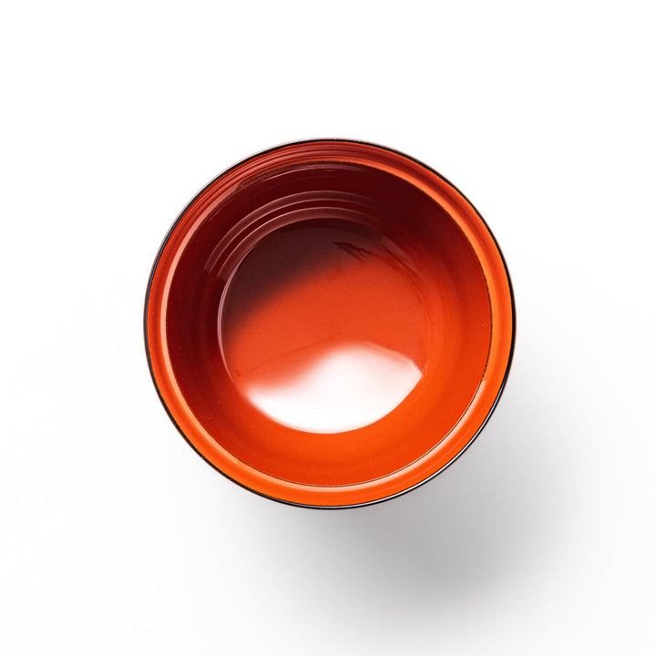 A lidded soup bowl with a warm brown color, adorned with small golden floral patterns.