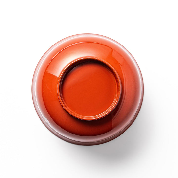 A lidded soup bowl with a warm brown color, adorned with small golden floral patterns.