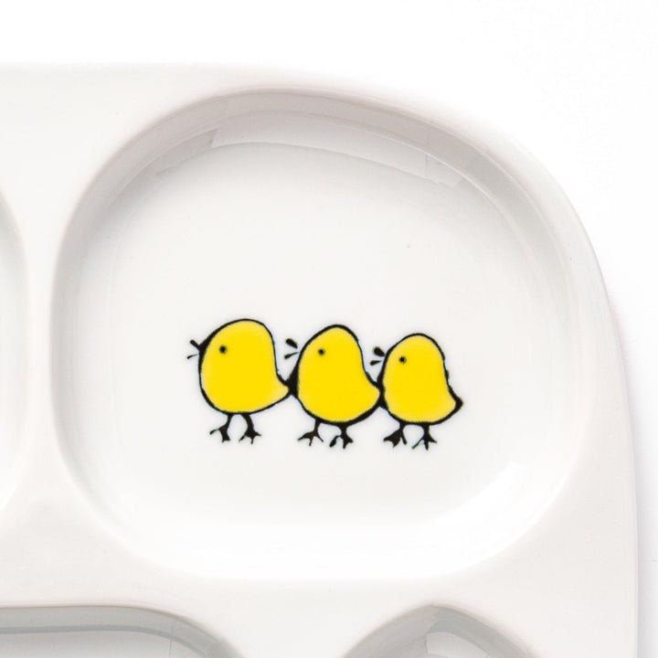 Adorable kids' plate featuring two snowbirds at the bottom and three yellow chicks at the top, with a light blue accent, perfect for brightening up mealtime.