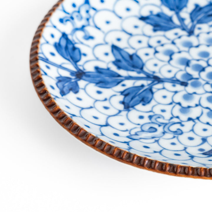 Dessert Plate featuring a beautiful blue spotted floral design with a delicate, beaded rim for an elegant touch.
