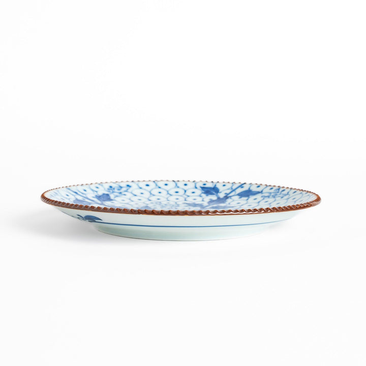 Salad Plate featuring a delicate blue spotted floral design with a beaded rim for an elegant touch.